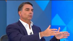 O que estava escrito na palma da mão de Flávio durante sabatina na Globo